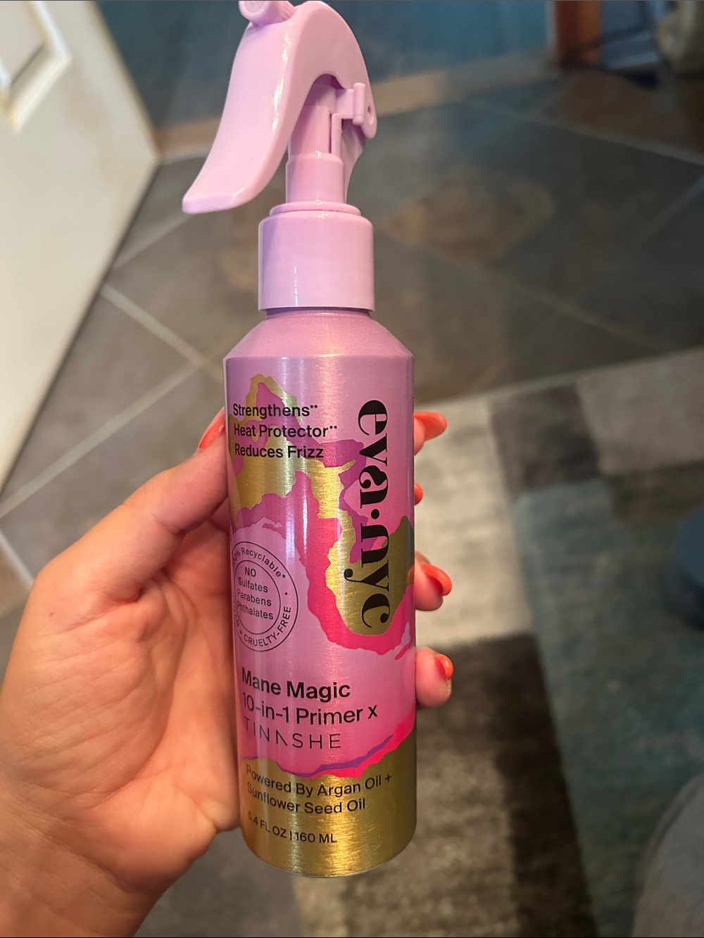 eva·nyc Mane Magic 10-in-1 Primer — Pink & Gold Bottle